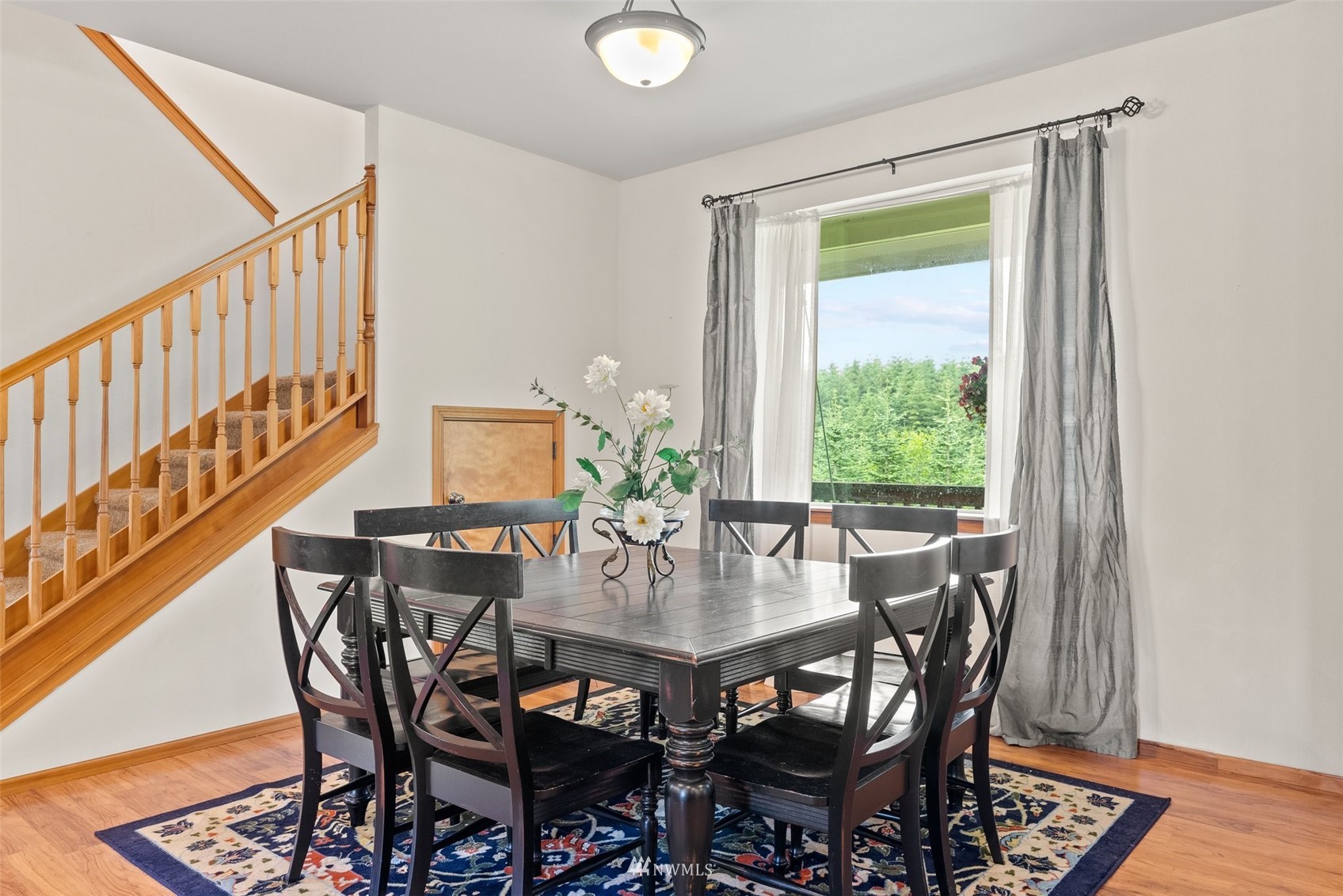 356 Wells Road Pe Ell, WA 98572 - Photo 11 of 40 a view of a dining room with furniture and wooden floor