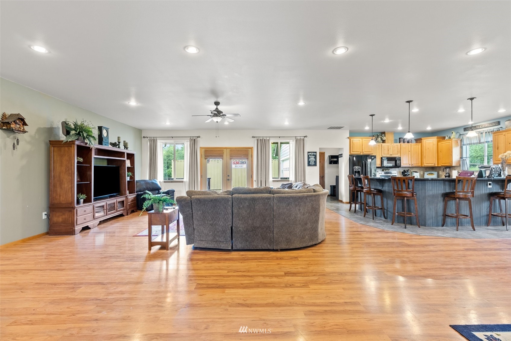 356 Wells Road Pe Ell, WA 98572 - Photo 12 of 40 a living room filled with lots of furniture and a flat screen tv