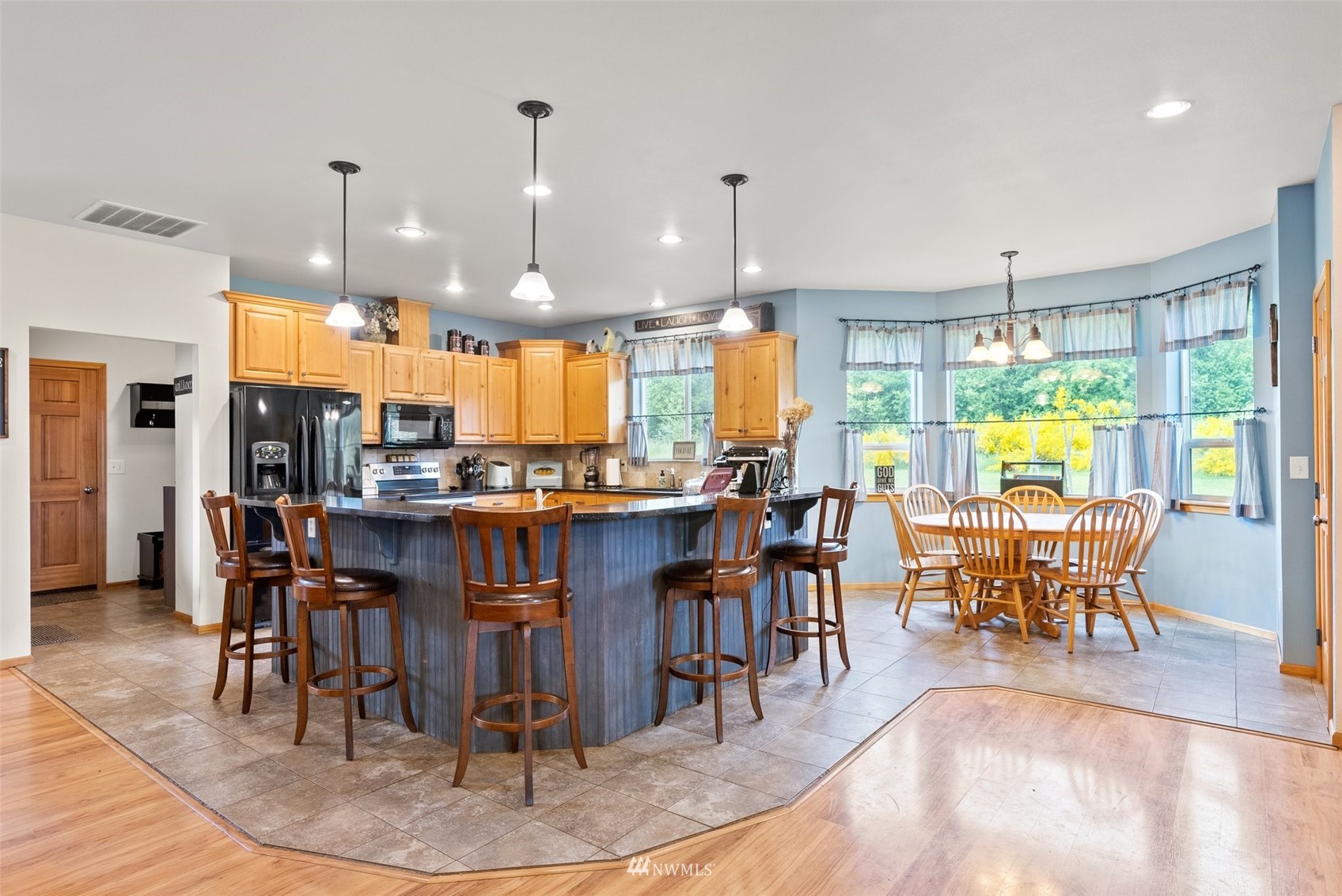 356 Wells Road Pe Ell, WA 98572 - Photo 13 of 40 a view of a dining area with furniture window and wooden floor