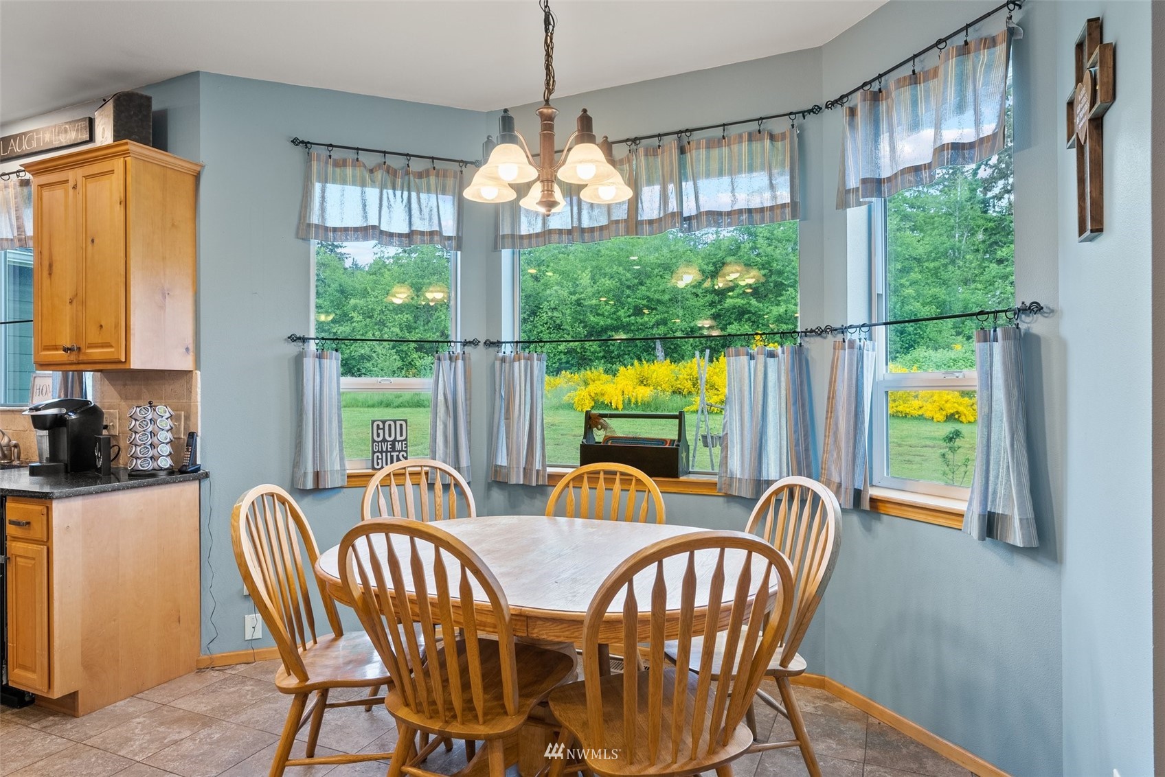 356 Wells Road Pe Ell, WA 98572 - Photo 17 of 40 a dining room with furniture a chandelier and a window
