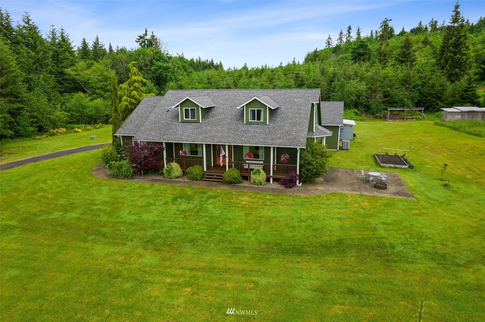 356 Wells Road Pe Ell, WA 98572 - Photo 2 of 40 a view of a house with a yard table and chairs