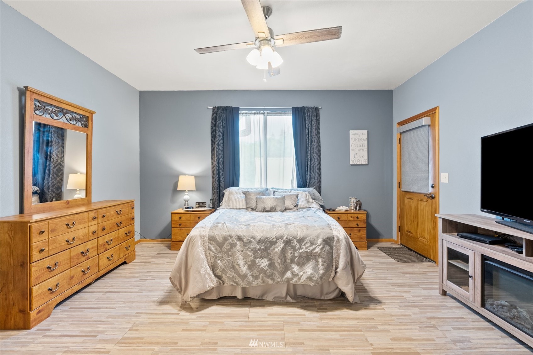 356 Wells Road Pe Ell, WA 98572 - Photo 21 of 40 a bedroom with a bed and a flat screen tv