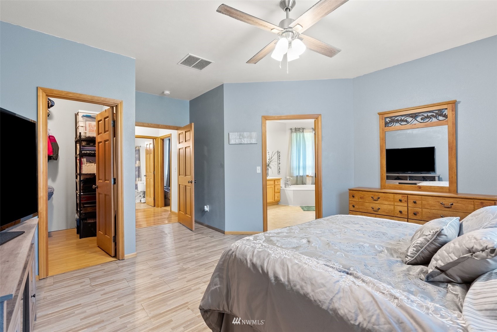 356 Wells Road Pe Ell, WA 98572 - Photo 22 of 40 a bedroom with a bed and a flat screen tv