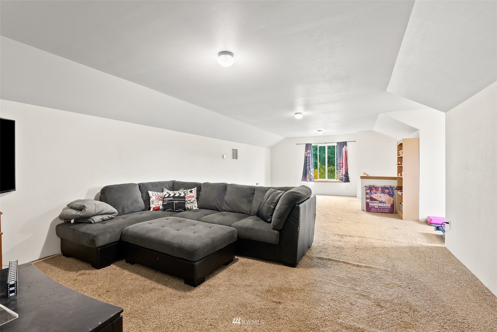 356 Wells Road Pe Ell, WA 98572 - Photo 28 of 40 a living room with furniture and a flat screen tv