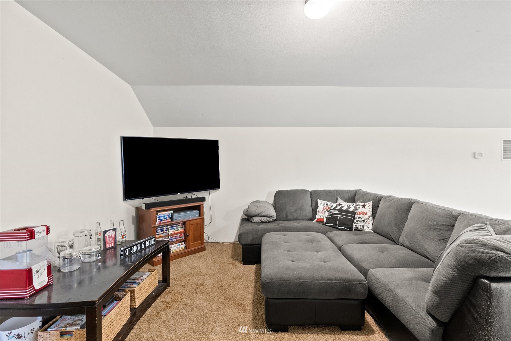 356 Wells Road Pe Ell, WA 98572 - Photo 29 of 40 a living room with furniture and a flat screen tv