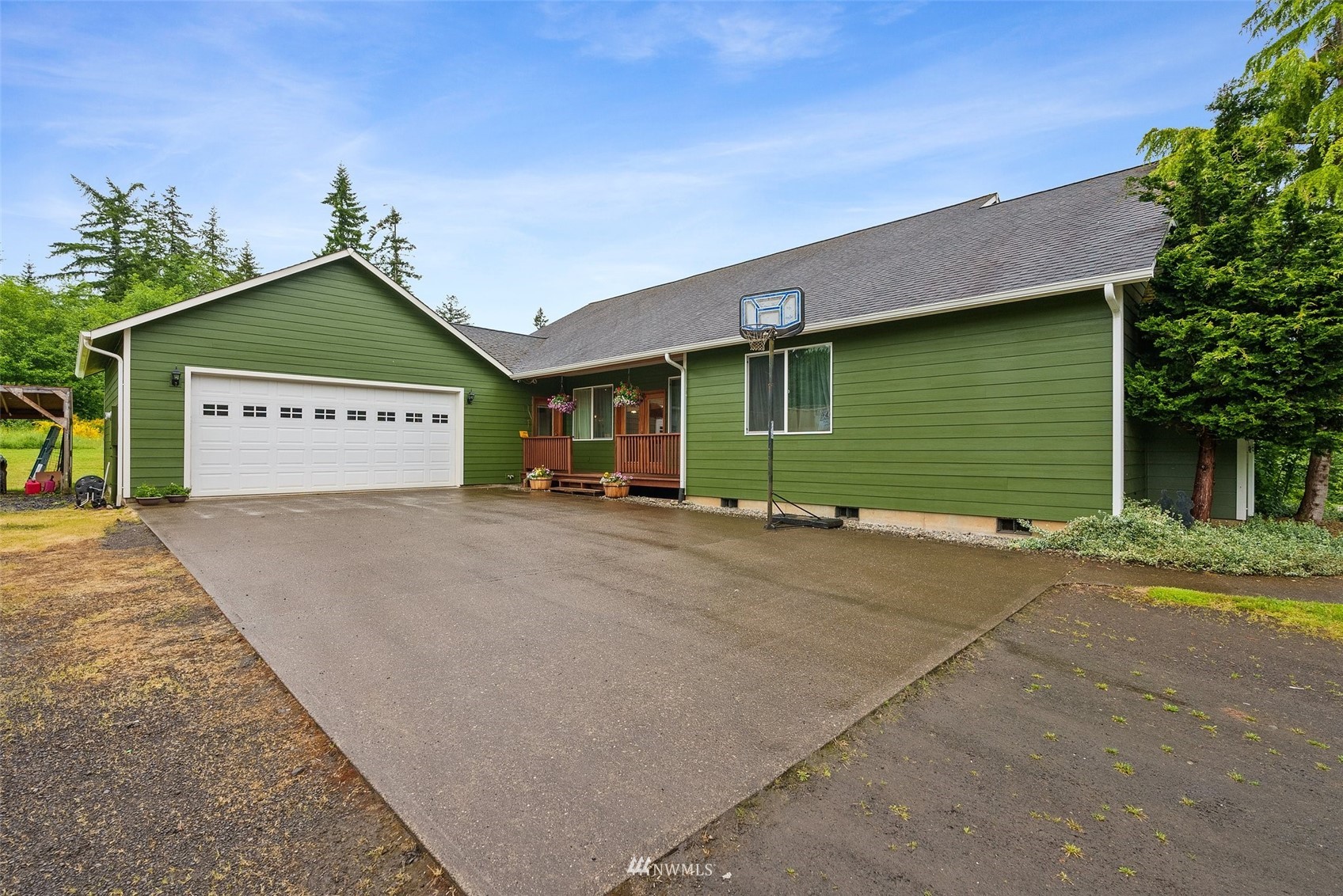 356 Wells Road Pe Ell, WA 98572 - Photo 4 of 40 a view of a house with a yard and garage