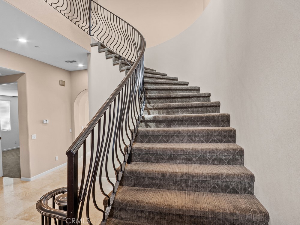 568 Vía Pueblo Riverside, CA 92507 - Photo 23 of 46 Grand staircase accented with ornate wrought-iron railings