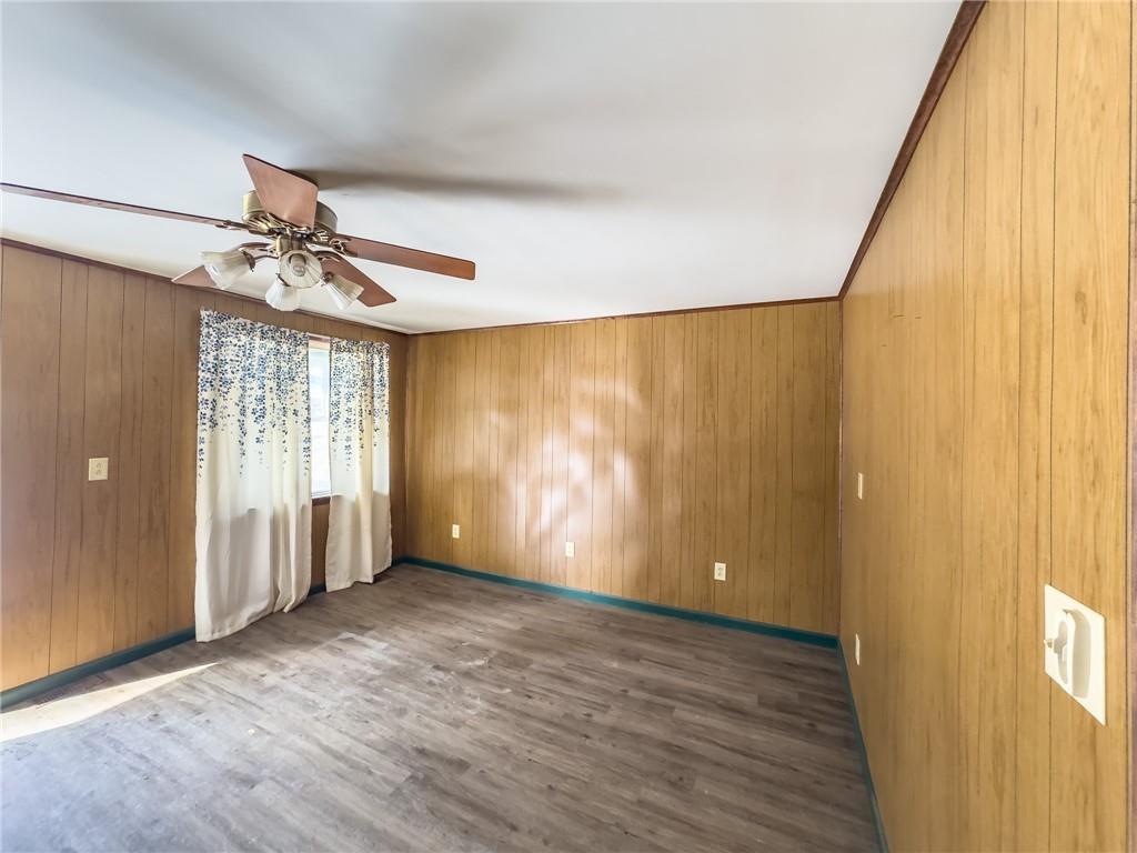 1167 Woolendean Road Treasure Lake, PA 15801 - Photo 15 of 36 wooden floor in an empty room with a window