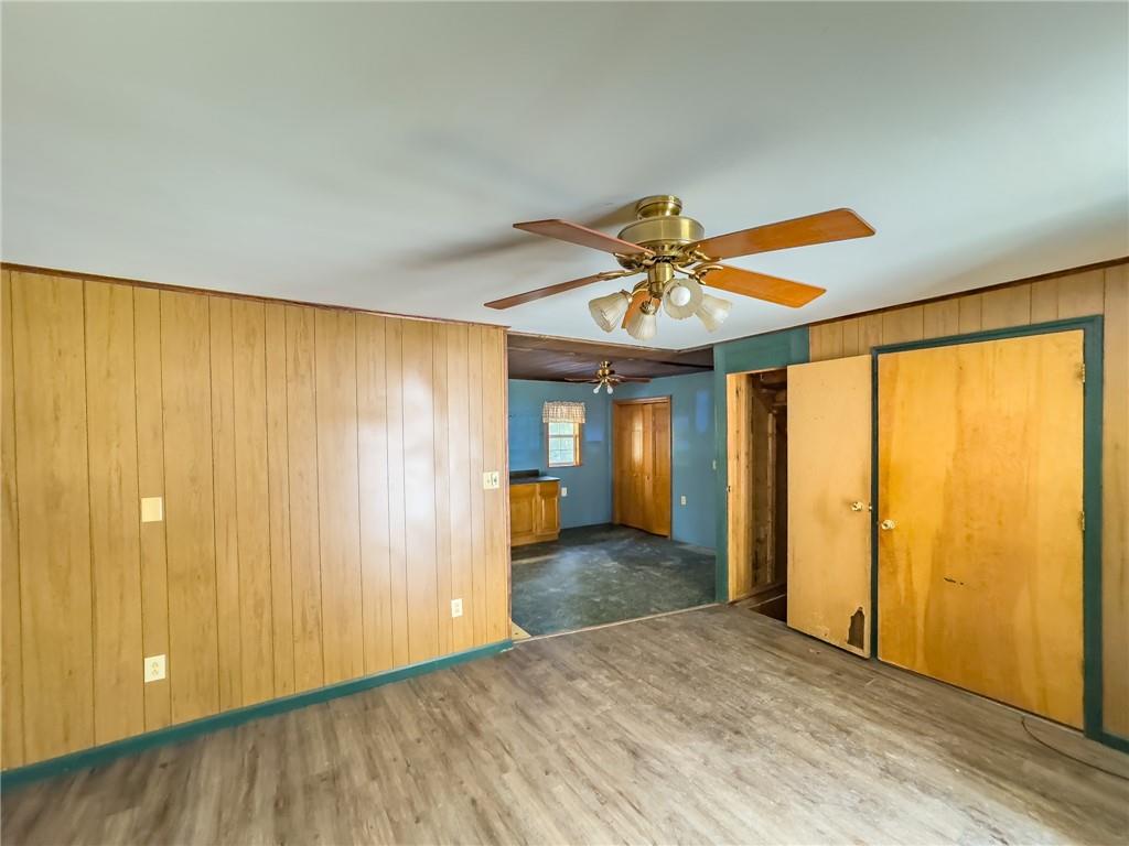 1167 Woolendean Road Treasure Lake, PA 15801 - Photo 18 of 36 wooden floor in an empty room with a window