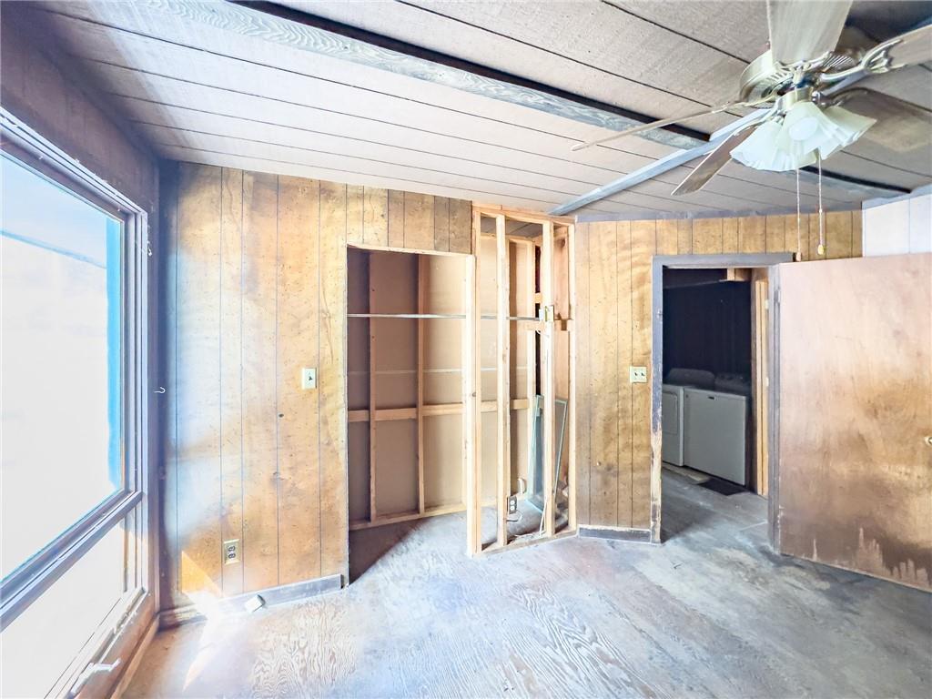 1167 Woolendean Road Treasure Lake, PA 15801 - Photo 23 of 36 an empty room with wooden floor and a ceiling fan