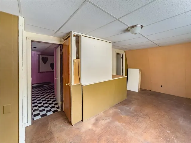 a view of a room with window and furniture