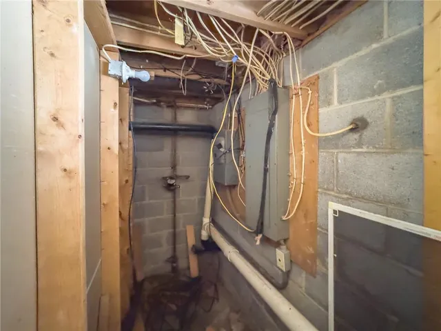 a bathroom with a granite countertop shower and a sink