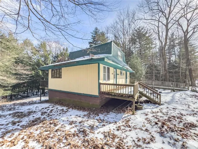 a view of backyard with a small cabin