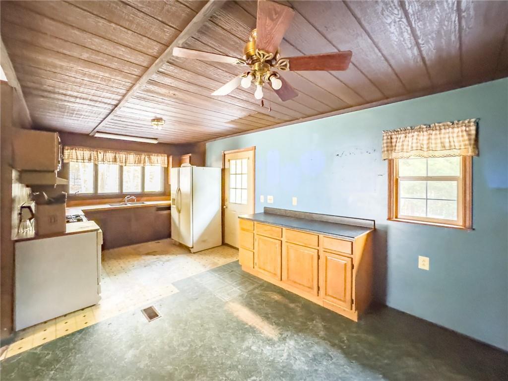 1167 Woolendean Road Treasure Lake, PA 15801 - Photo 10 of 36 a view of a kitchen with a sink and a dishwasher next to a window