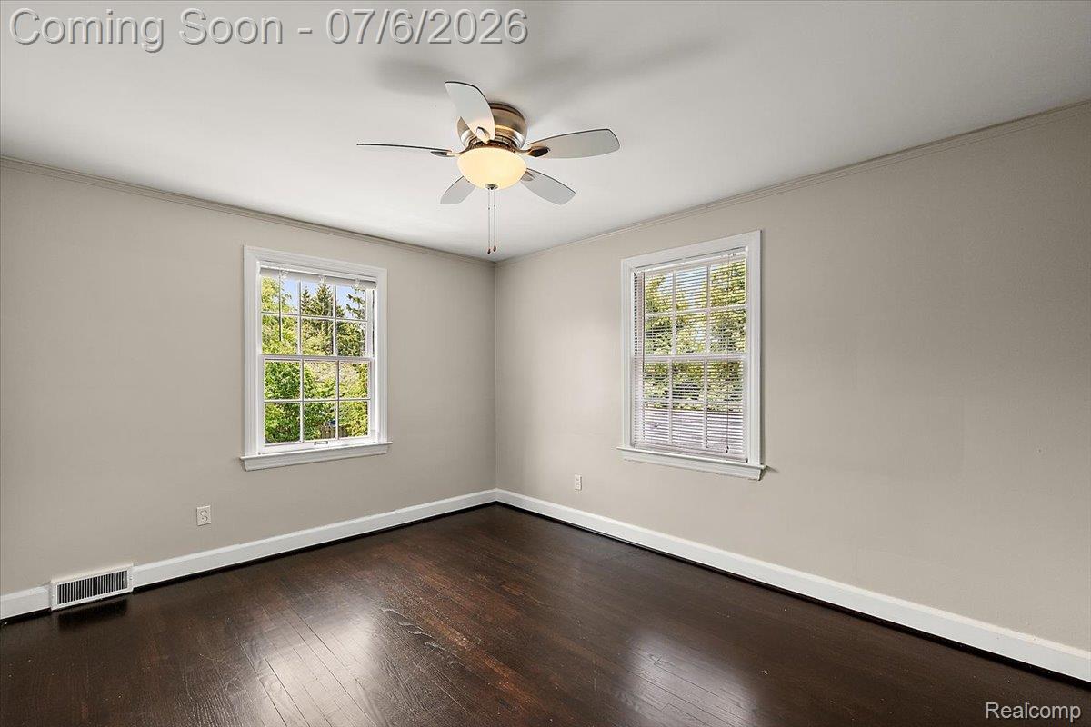 1051 Devonshire Road Grosse Pointe, MI 48230 - Photo 56 of 98 Room featuring dark wood-finish flooring, light neutral-toned walls, and white trim