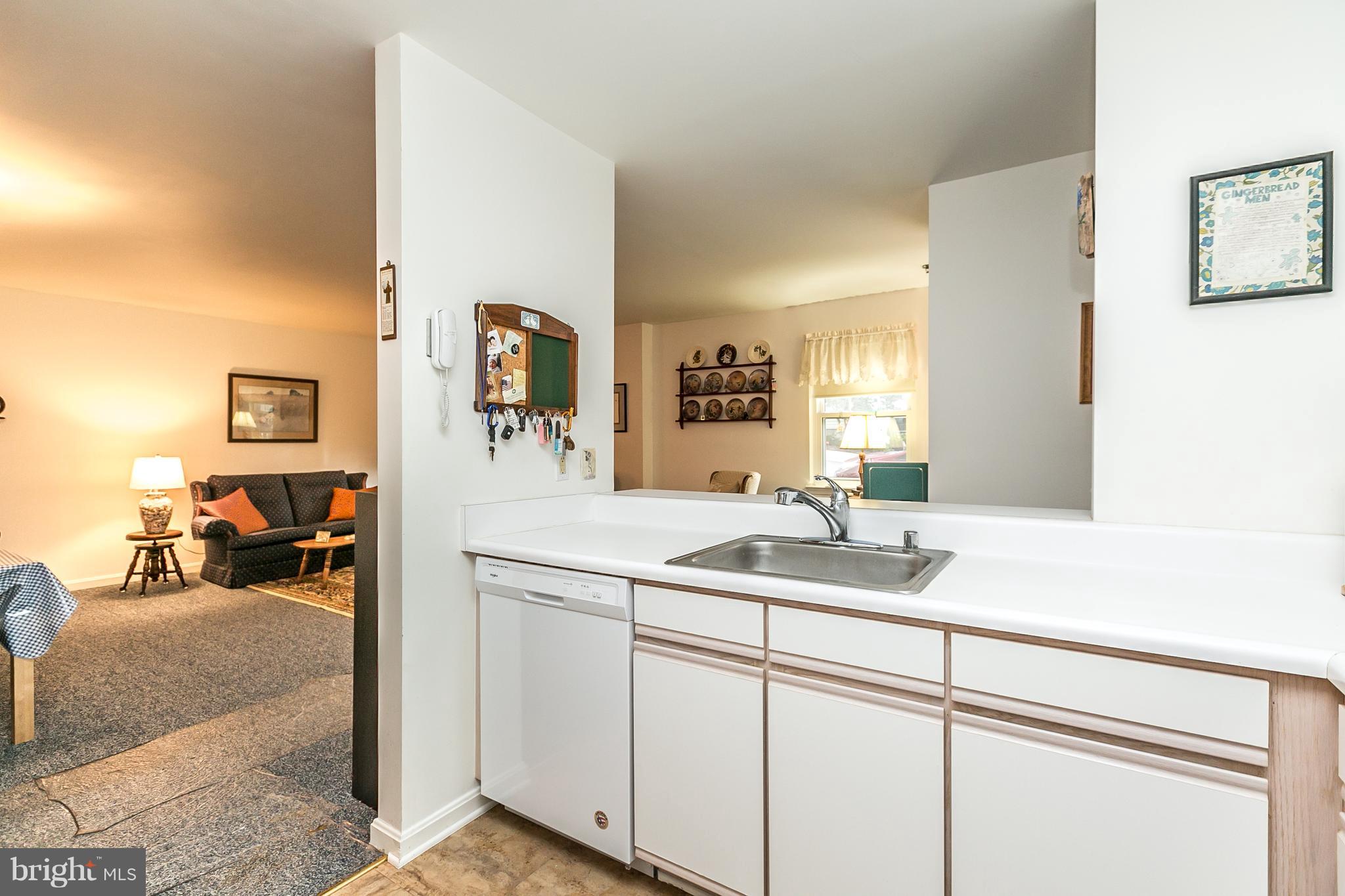 520 McManus Way, Unit C1 Towson, MD 21286 - Photo 8 of 16 Kitchen opens into dining and living space