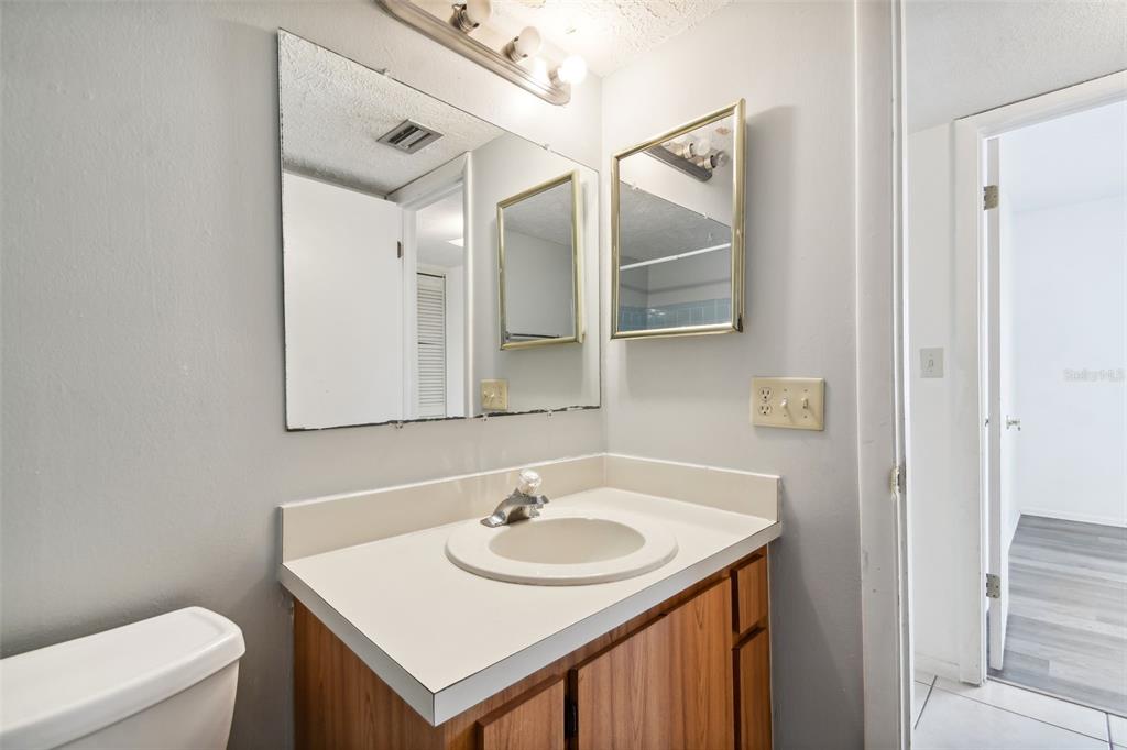645 North Keene Road, Unit D Clearwater, FL 33755 - Photo 15 of 27 a bathroom with a sink and a toilet