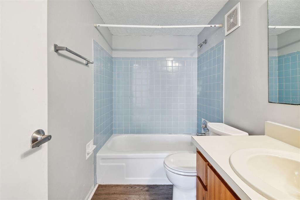 645 North Keene Road, Unit D Clearwater, FL 33755 - Photo 16 of 27 a bathroom with a sink a toilet and shower