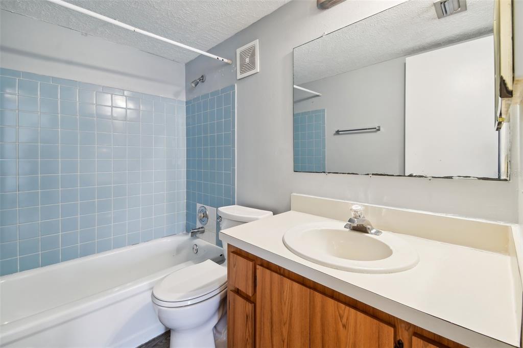 645 North Keene Road, Unit D Clearwater, FL 33755 - Photo 17 of 27 a bathroom with a sink and a mirror