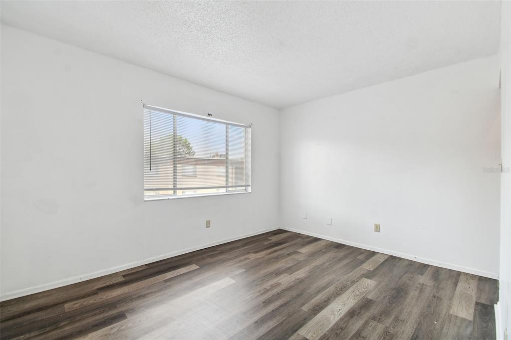 645 North Keene Road, Unit D Clearwater, FL 33755 - Photo 22 of 27 an empty room with a window