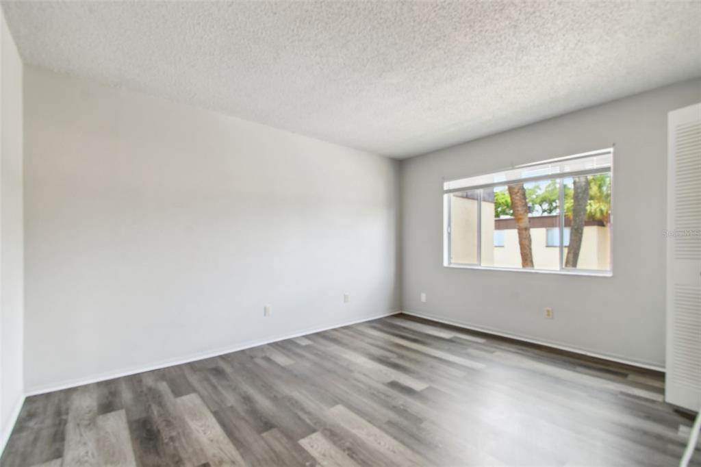 645 North Keene Road, Unit D Clearwater, FL 33755 - Photo 26 of 27 an empty room with a window