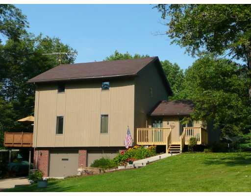 Exterior Front. FRESHLY PAINTED EXTERIOR INCLUDING NEW FRONT DECK AND NEW CONCRETE SIDEWALK.