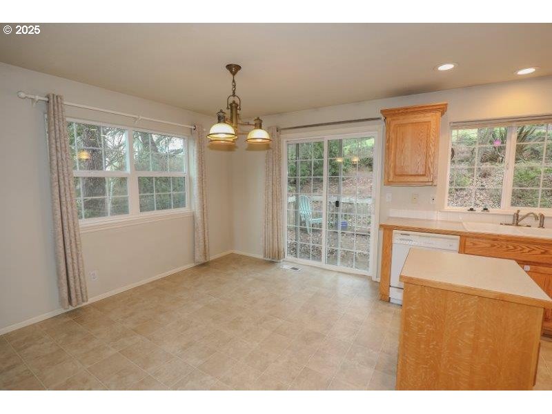 1147 Southeast Kane Street Roseburg, OR 97470 - Photo 13 of 41 a view of an empty room with a window