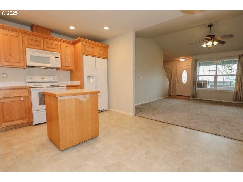 1147 Southeast Kane Street Roseburg, OR 97470 - Photo 15 of 41 a view of a kitchen with a stove cabinets and a kitchen