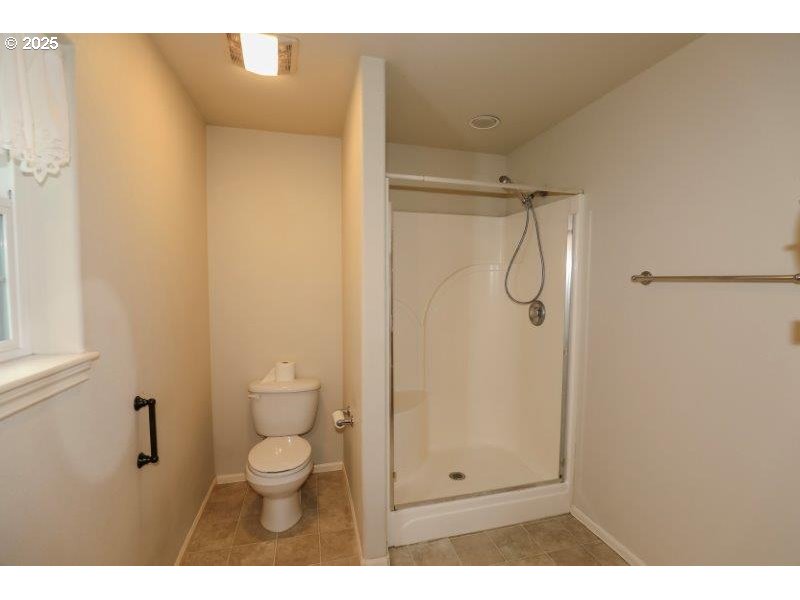 1147 Southeast Kane Street Roseburg, OR 97470 - Photo 24 of 41 a bathroom with a granite countertop shower and a toilet