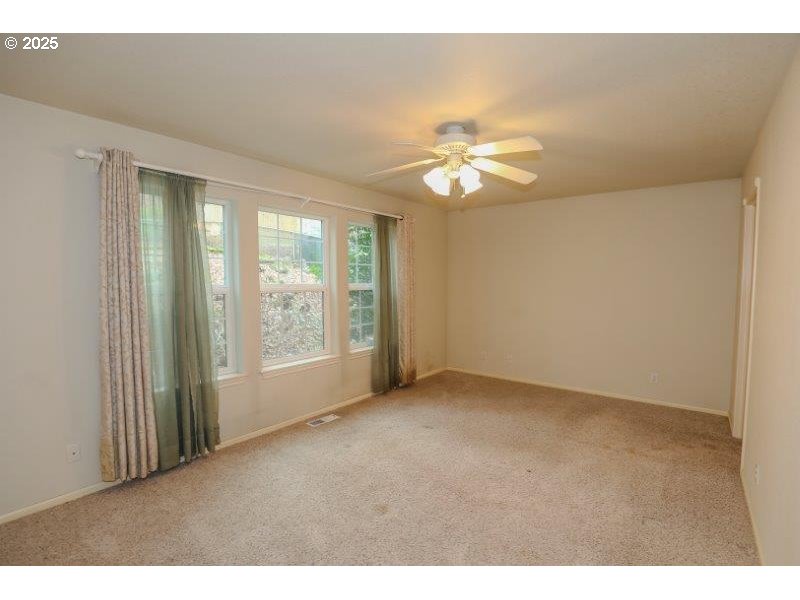 1147 Southeast Kane Street Roseburg, OR 97470 - Photo 27 of 41 a view of an empty room with a window