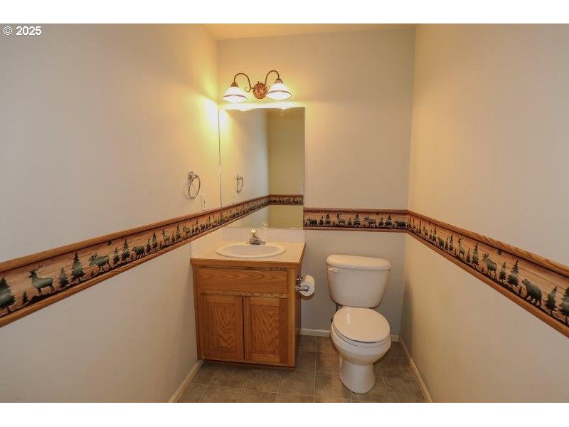 1147 Southeast Kane Street Roseburg, OR 97470 - Photo 28 of 41 a bathroom with a toilet and a sink