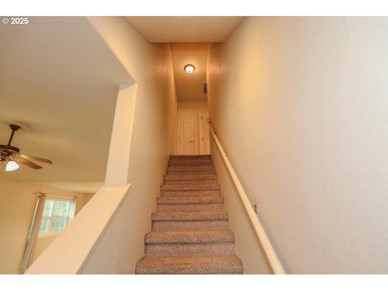 1147 Southeast Kane Street Roseburg, OR 97470 - Photo 29 of 41 a view of a hallway with wooden floor and staircase