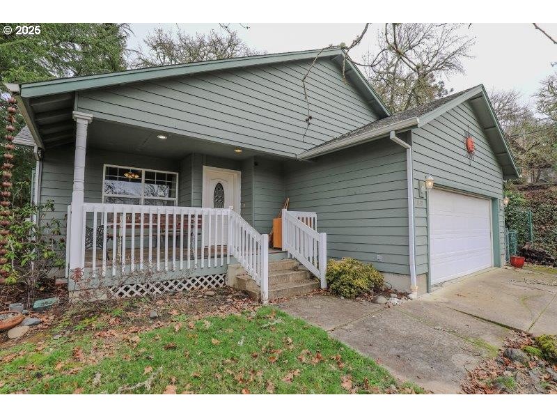 1147 Southeast Kane Street Roseburg, OR 97470 - Photo 4 of 41 a view of back yard of the house