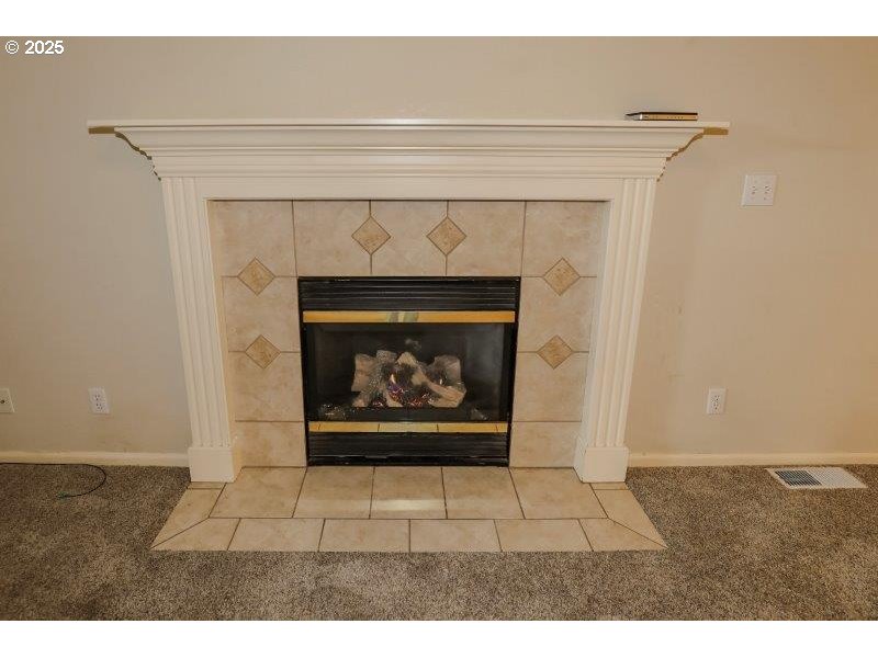 1147 Southeast Kane Street Roseburg, OR 97470 - Photo 8 of 41 a picture of a living room with a fireplace