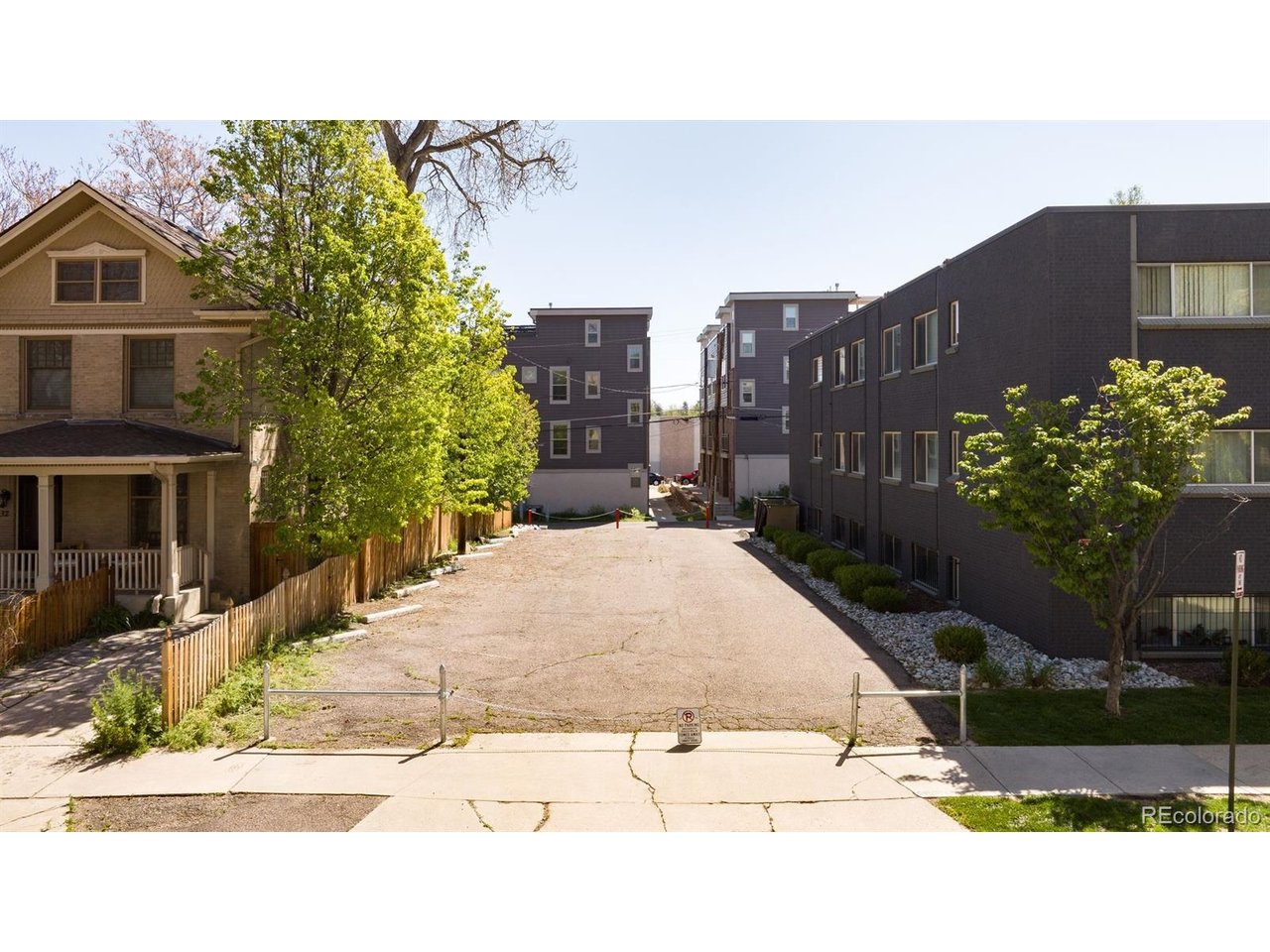 1324 Garfield Street Denver, CO 80206 - Photo 2 of 22 a view of a street with a building in the background