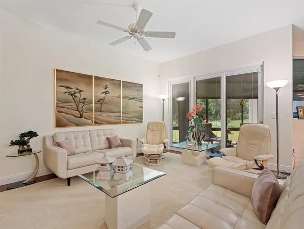an empty room with sliding glass door and shower