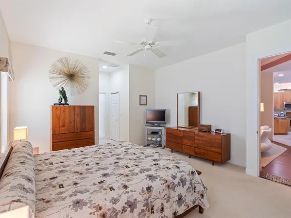 a spacious bathroom with a granite countertop sink a mirror and a