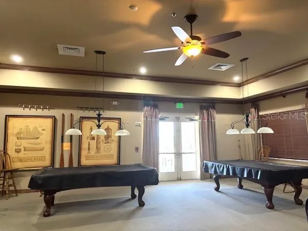 a view of a a dining room with furniture window and outside view