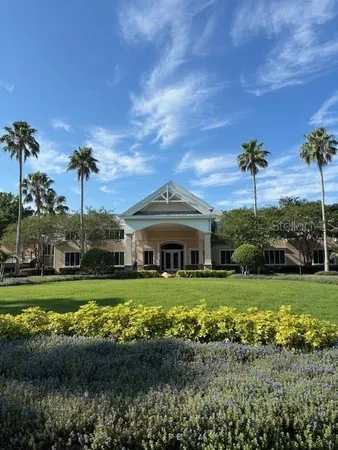 a kitchen with a chandelier a dining table and window