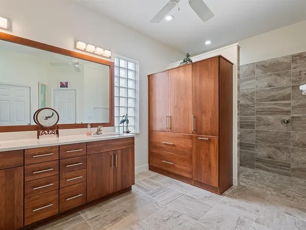 a bathroom with a double vanity sink and a mirror