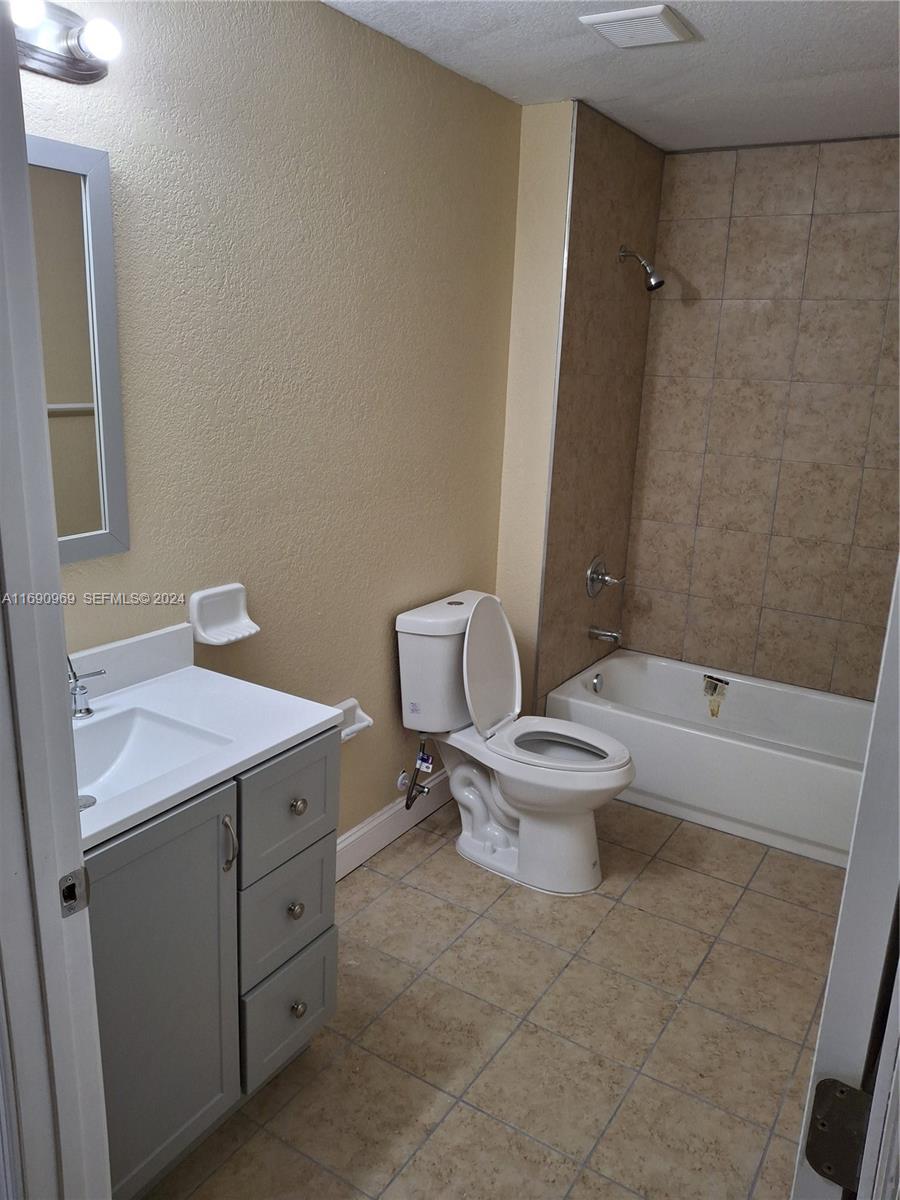 509 North 22nd Street Fort Pierce, FL 34950 - Photo 14 of 18 a bathroom with a sink a toilet and shower