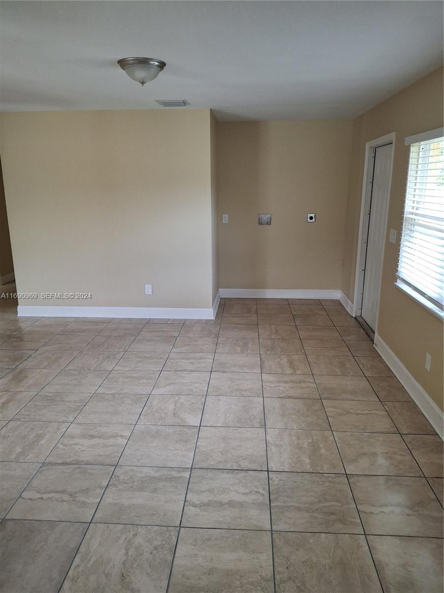 509 North 22nd Street Fort Pierce, FL 34950 - Photo 9 of 18 a view of an empty room with a window