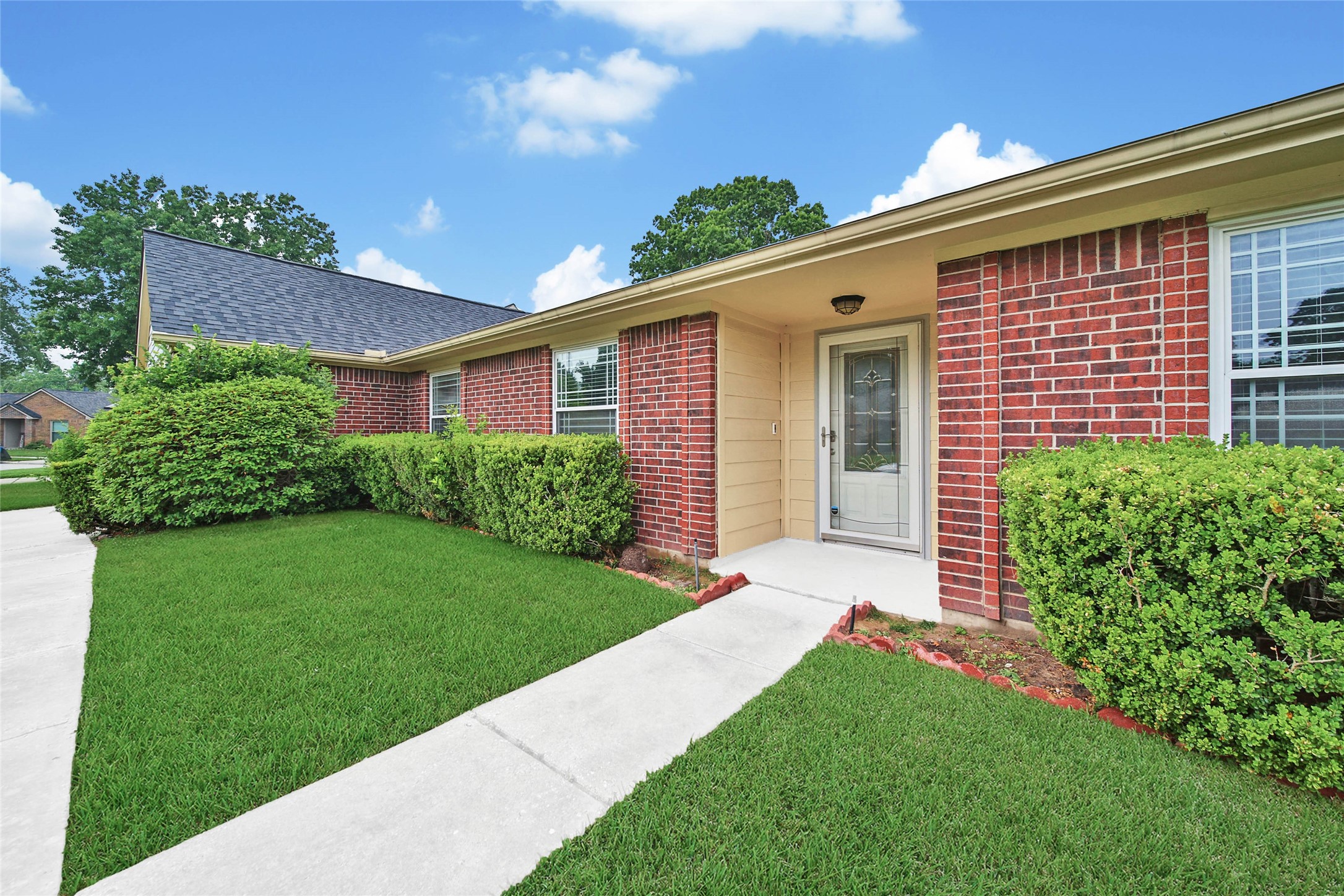 5010 Cupids Bower Court Spring, TX 77388 - Photo 3 of 40 a front view of a house with a yard