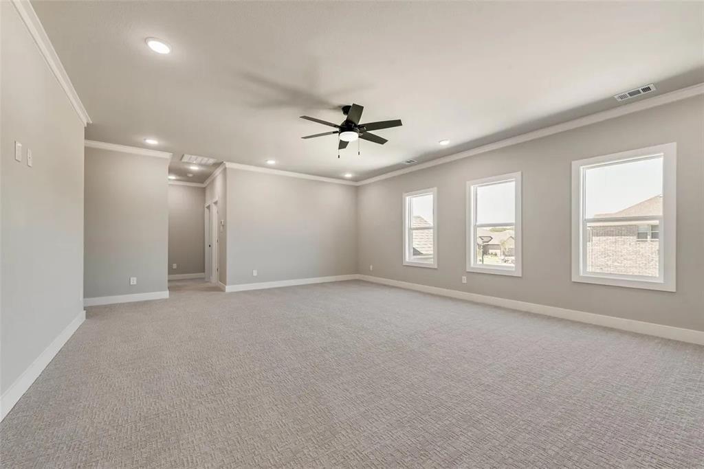 1327 Selby Road Van Alstyne, TX 75495 - Photo 17 of 32 Unfurnished room featuring crown molding, ceiling fan, carpet flooring, and recessed lighting