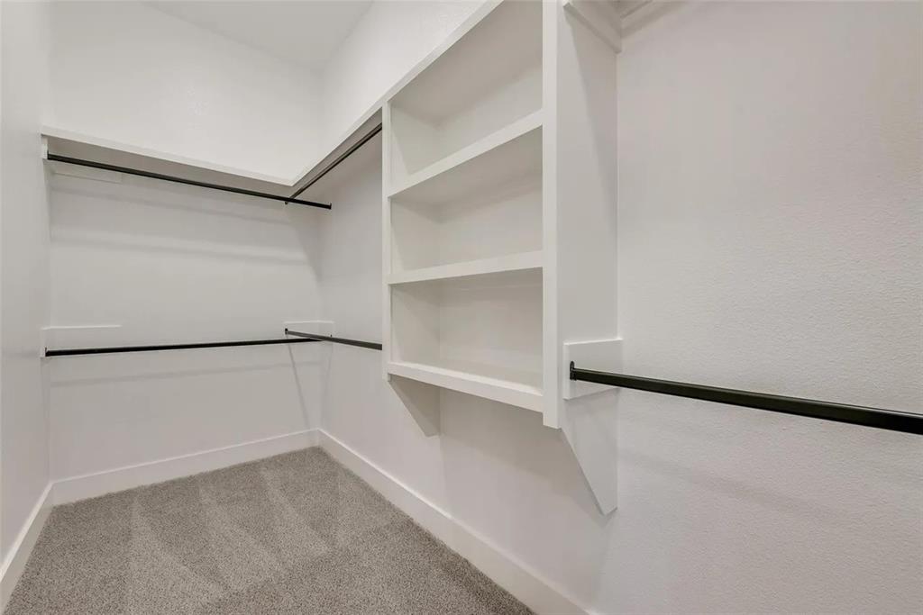 1327 Selby Road Van Alstyne, TX 75495 - Photo 24 of 32 Walk in closet with light carpet