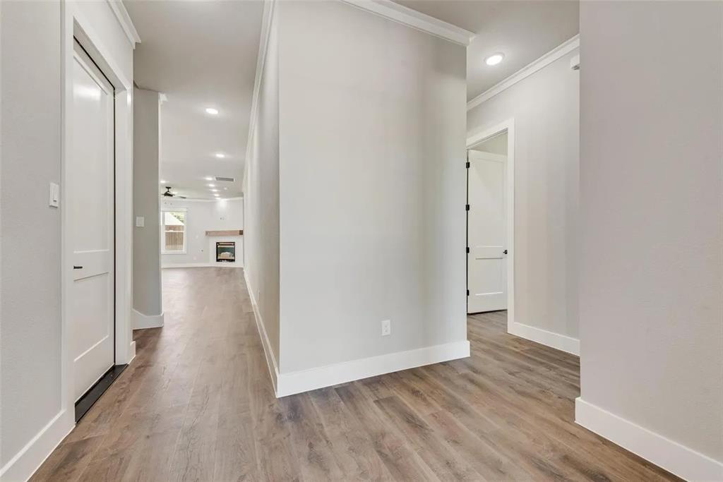 1327 Selby Road Van Alstyne, TX 75495 - Photo 29 of 32 Hallway featuring light wood finished floors, recessed lighting, and crown molding