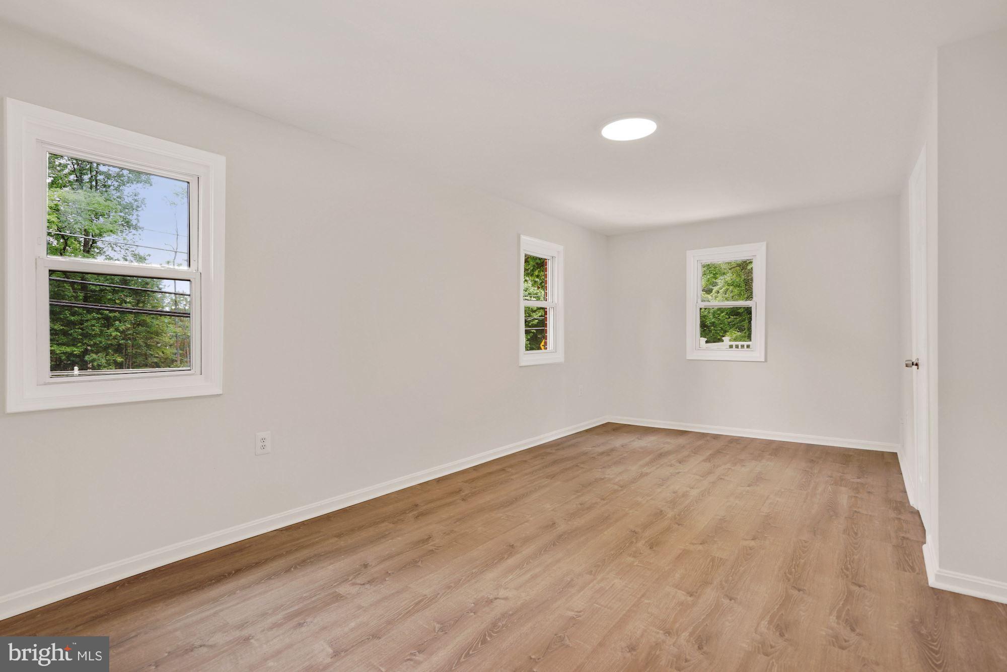 9101 Old Keene Mill Road Springfield, VA 22152 - Photo 14 of 28 an empty room with windows