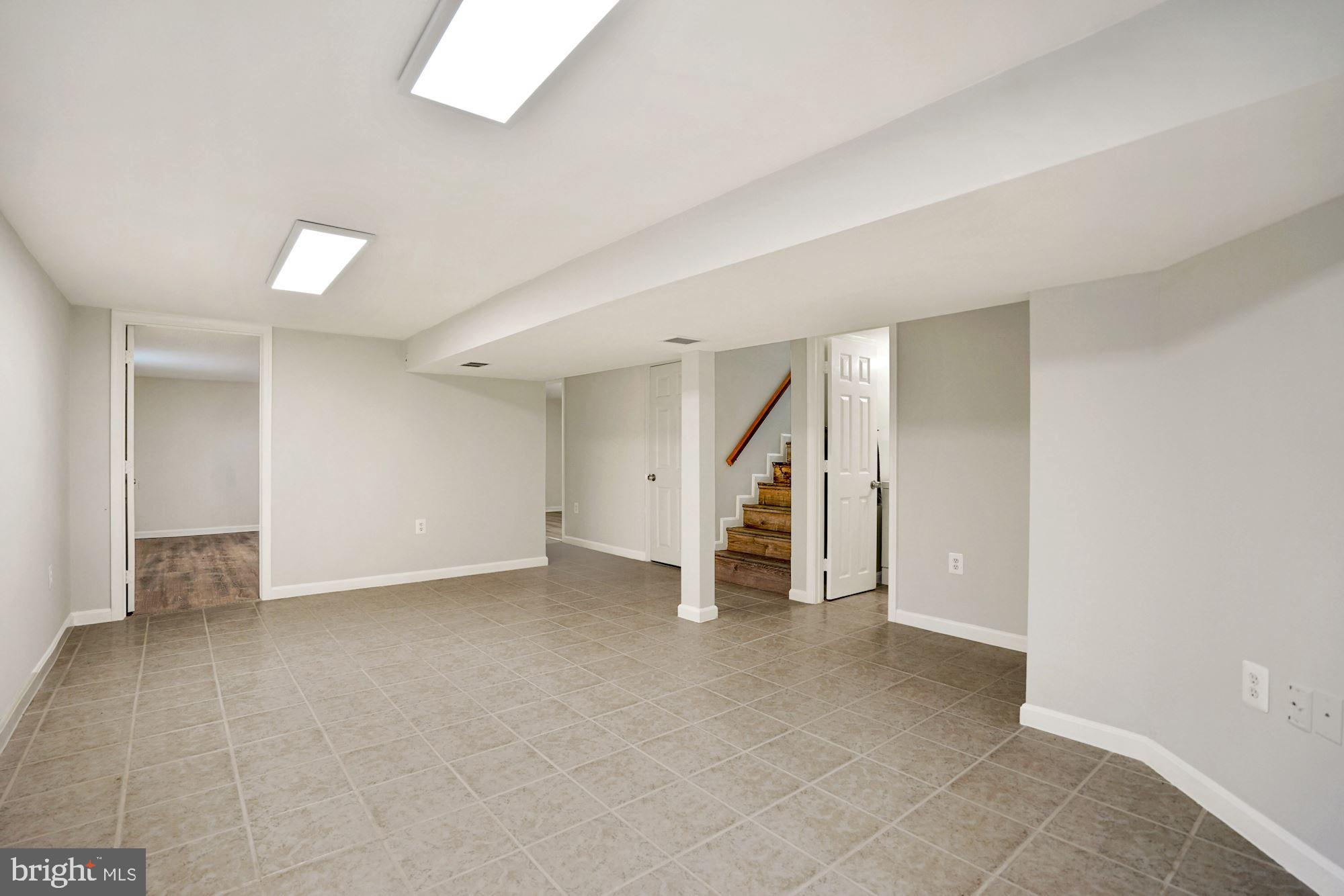 9101 Old Keene Mill Road Springfield, VA 22152 - Photo 19 of 28 a view of an empty room with stairs