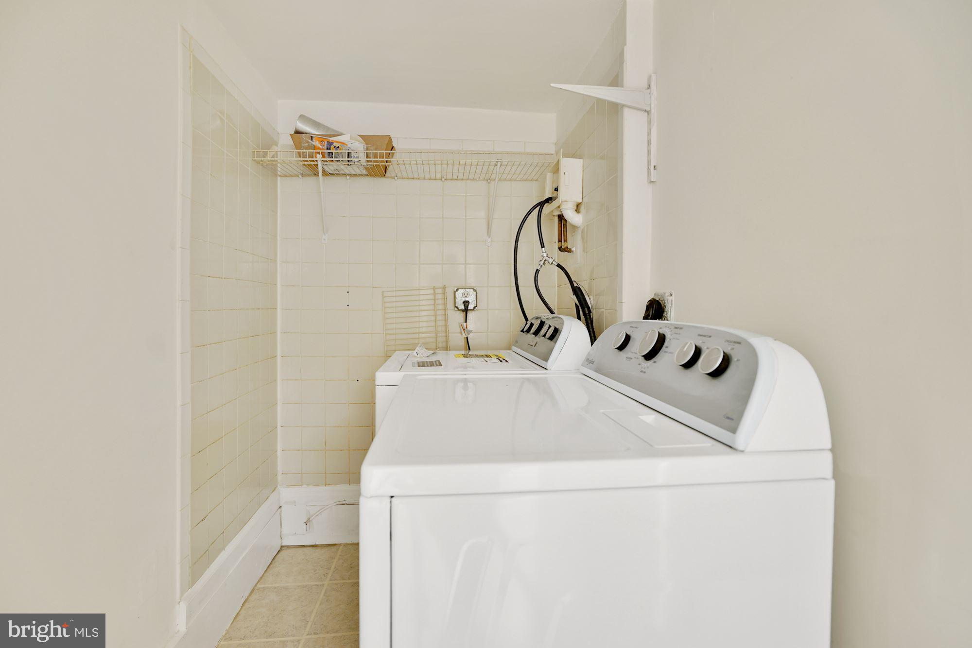 9101 Old Keene Mill Road Springfield, VA 22152 - Photo 20 of 28 a utility room with dryer and washer