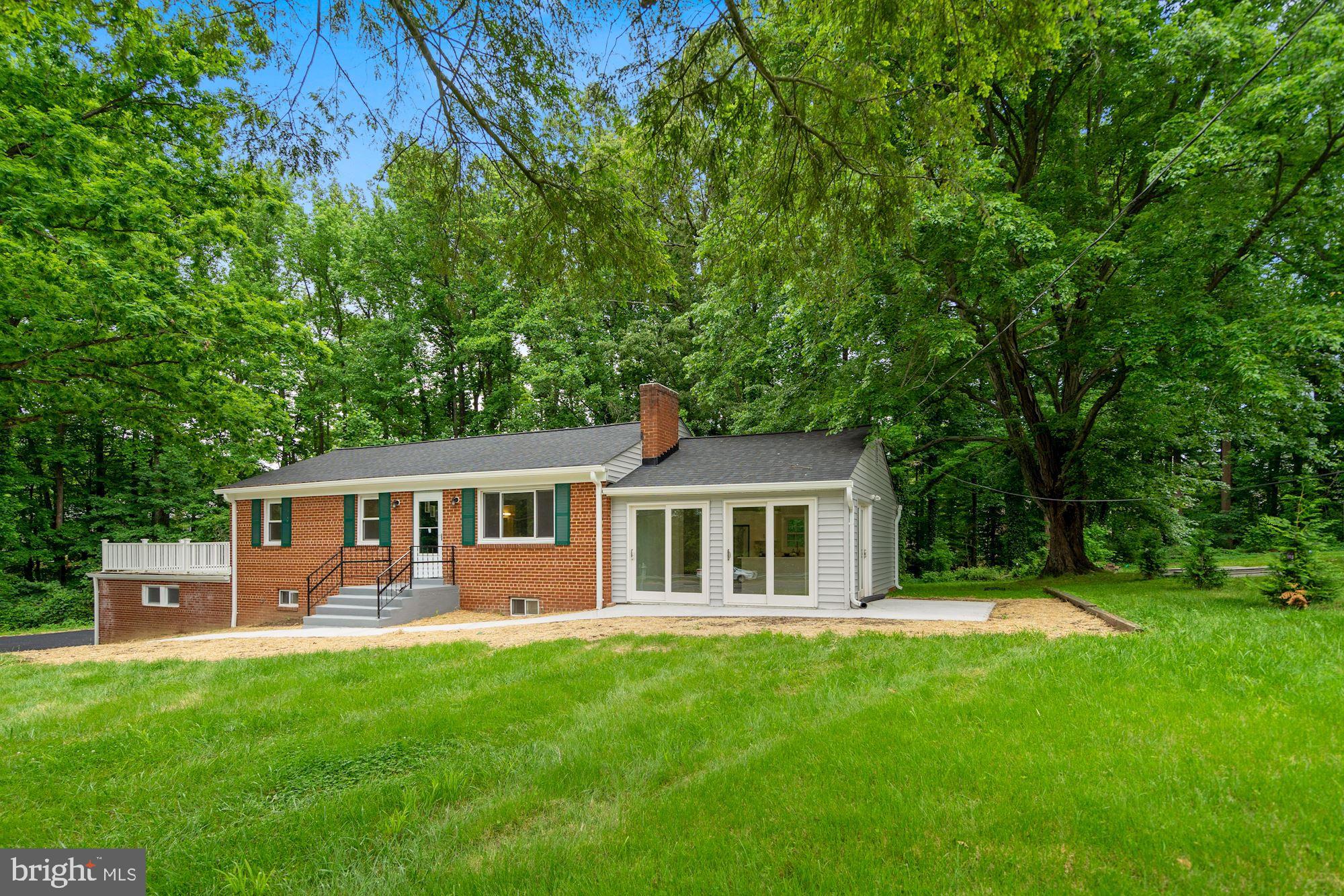 9101 Old Keene Mill Road Springfield, VA 22152 - Photo 2 of 28 a view of a house with a backyard